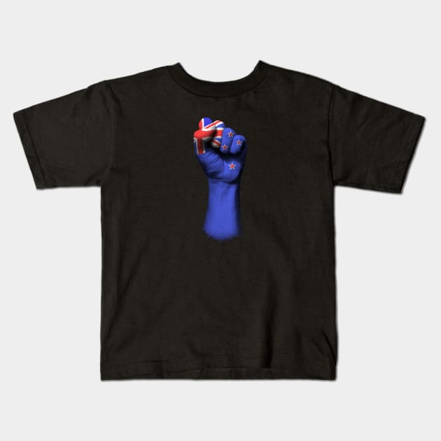 Flag of New Zealand on a Raised Clenched Fist Kids T-Shirt by jeffbartels